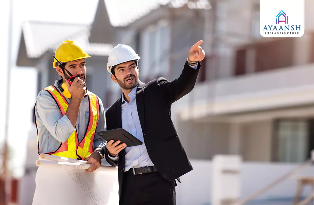 Builders Discussing Project Plans at Construction Site