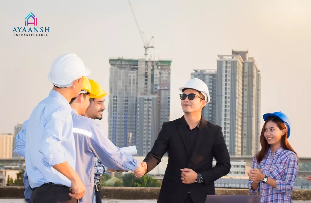 Construction Team Meeting at Site with City Skyline